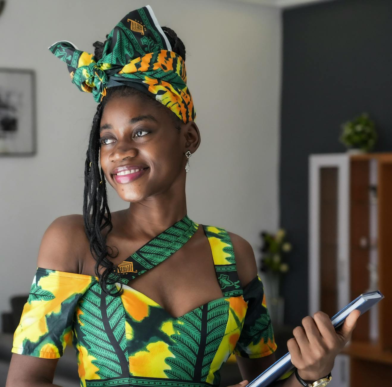 beautiful woman with green and yellow dress and head wrap